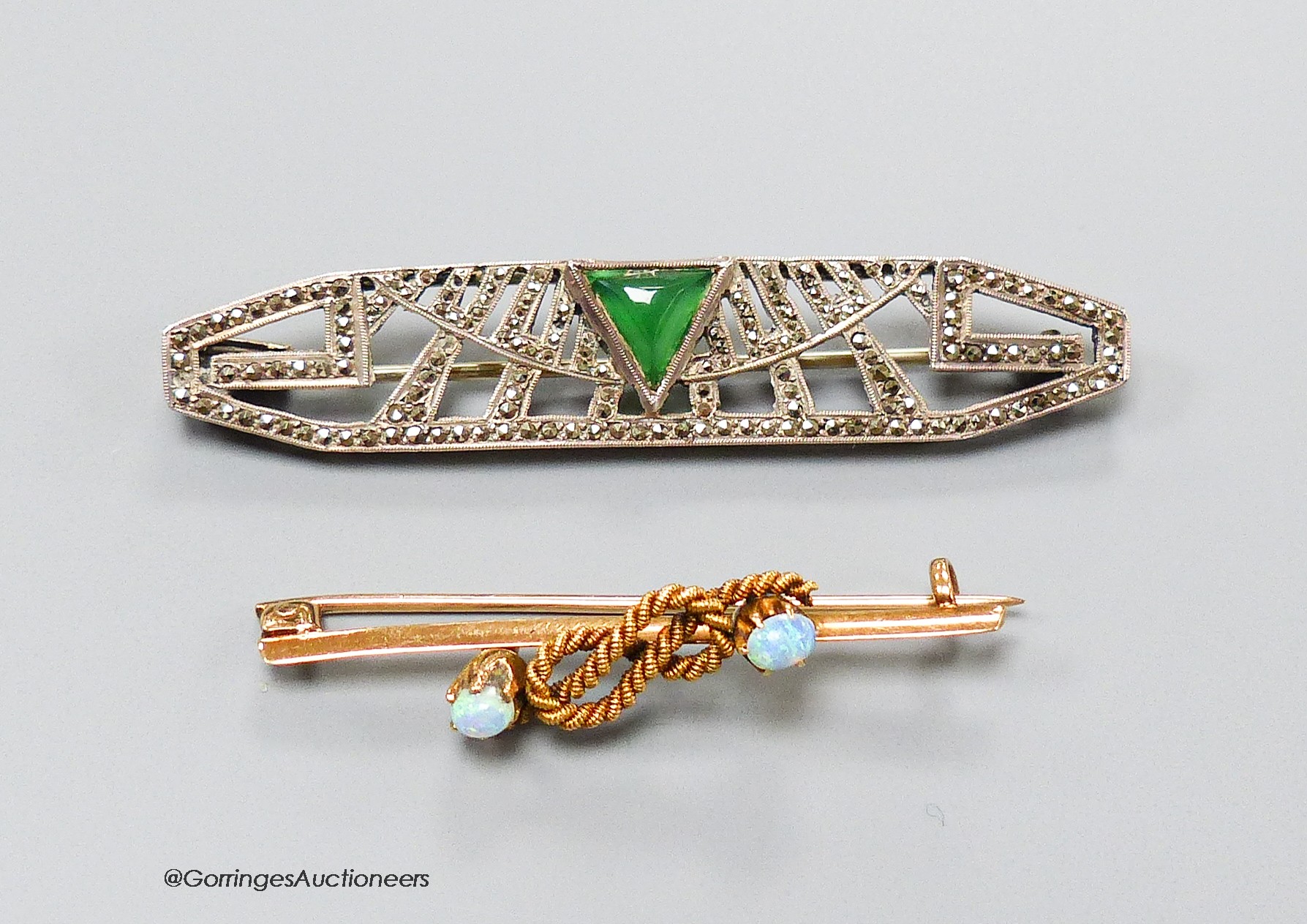 A yellow metal and two stone opal set ropetwist bar brooch, 42mm, gross 3.4 grams and a French Art Deco, chrysoprase and marcasite set bar brooch.